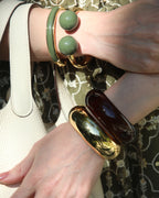 Pulseira dourada bola verde